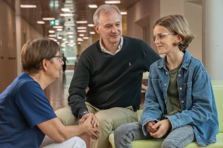 Study nurse with father and son